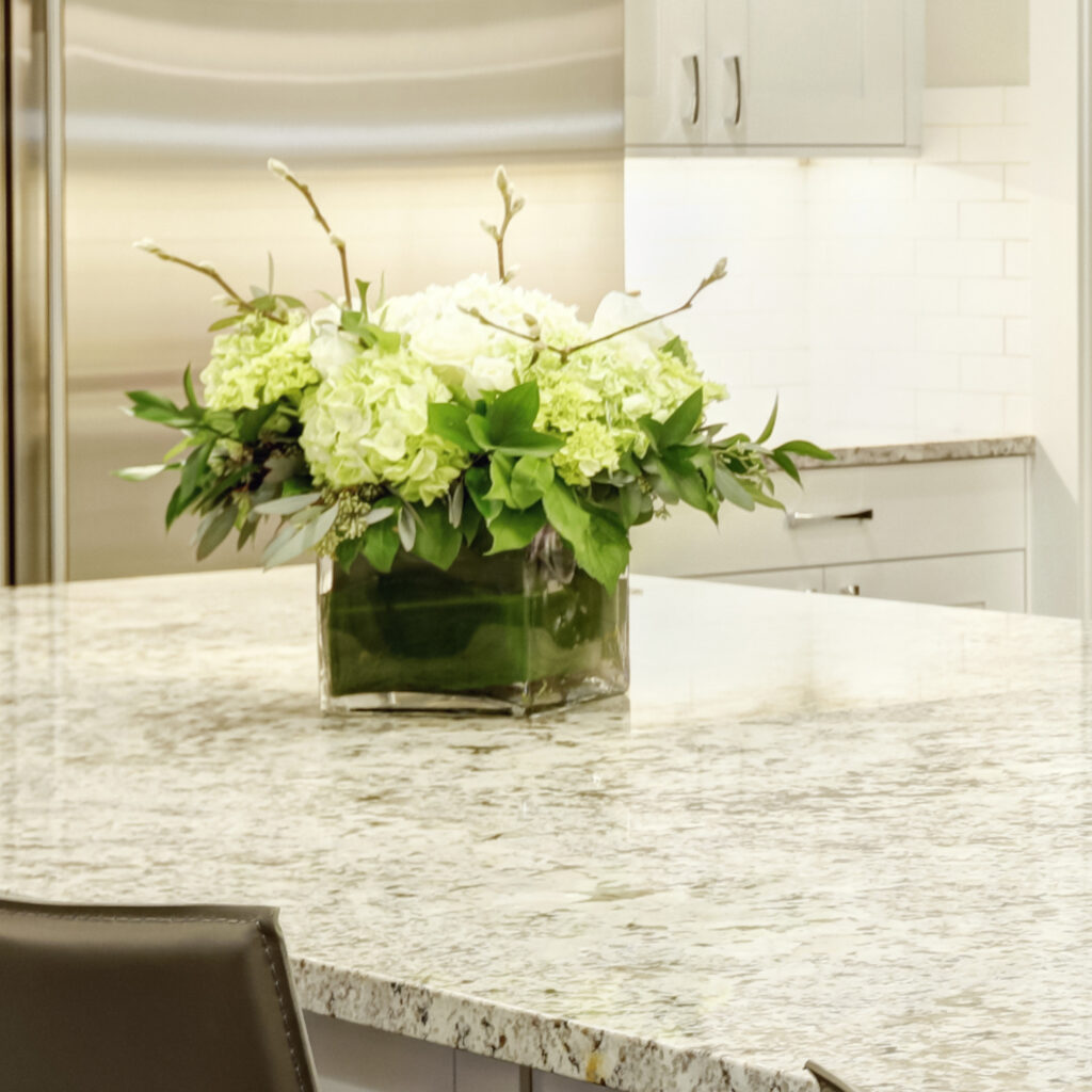 Floral arrangement on countertop in a custom modular home.