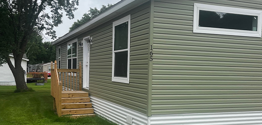 Green exterior and front stairs of Skyline Arlington J314