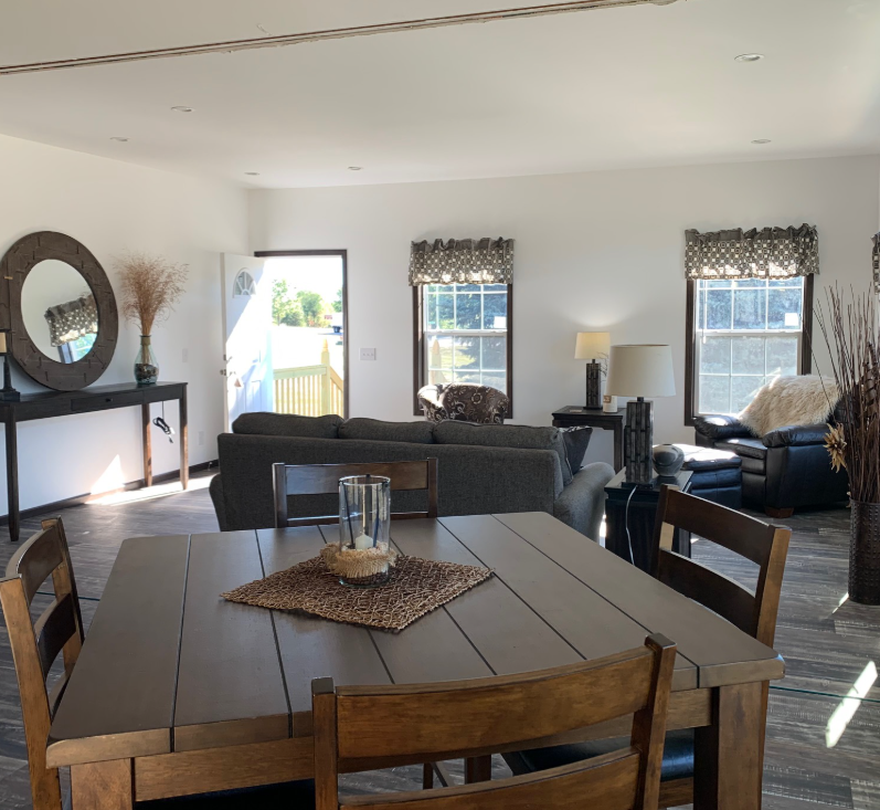Furnished Highland Kingsbrook modular home dining room and kitchen