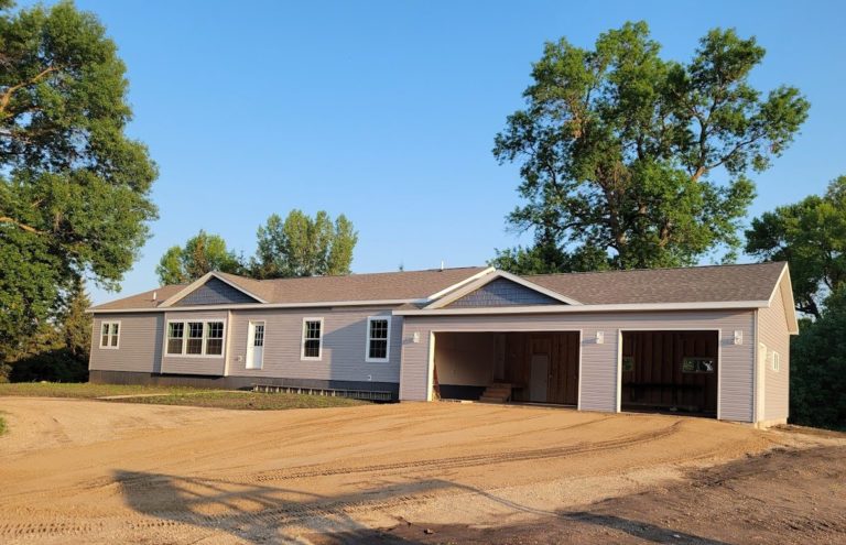 New modular home build that is awaiting garage doors and a completed driveway